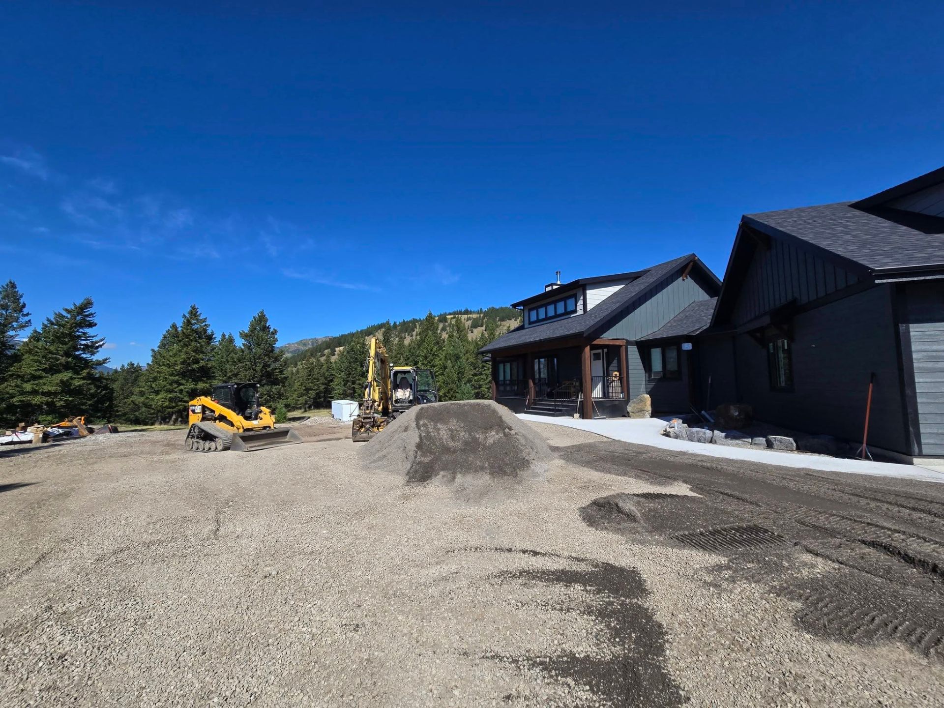 Excavator on a freshly graded lot