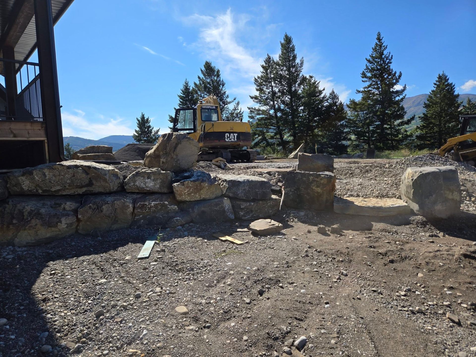 Rock retaining wall with excavator